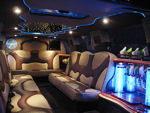 Chauffeur stretched Ford Excursion 4x4 limo hire interior in UK